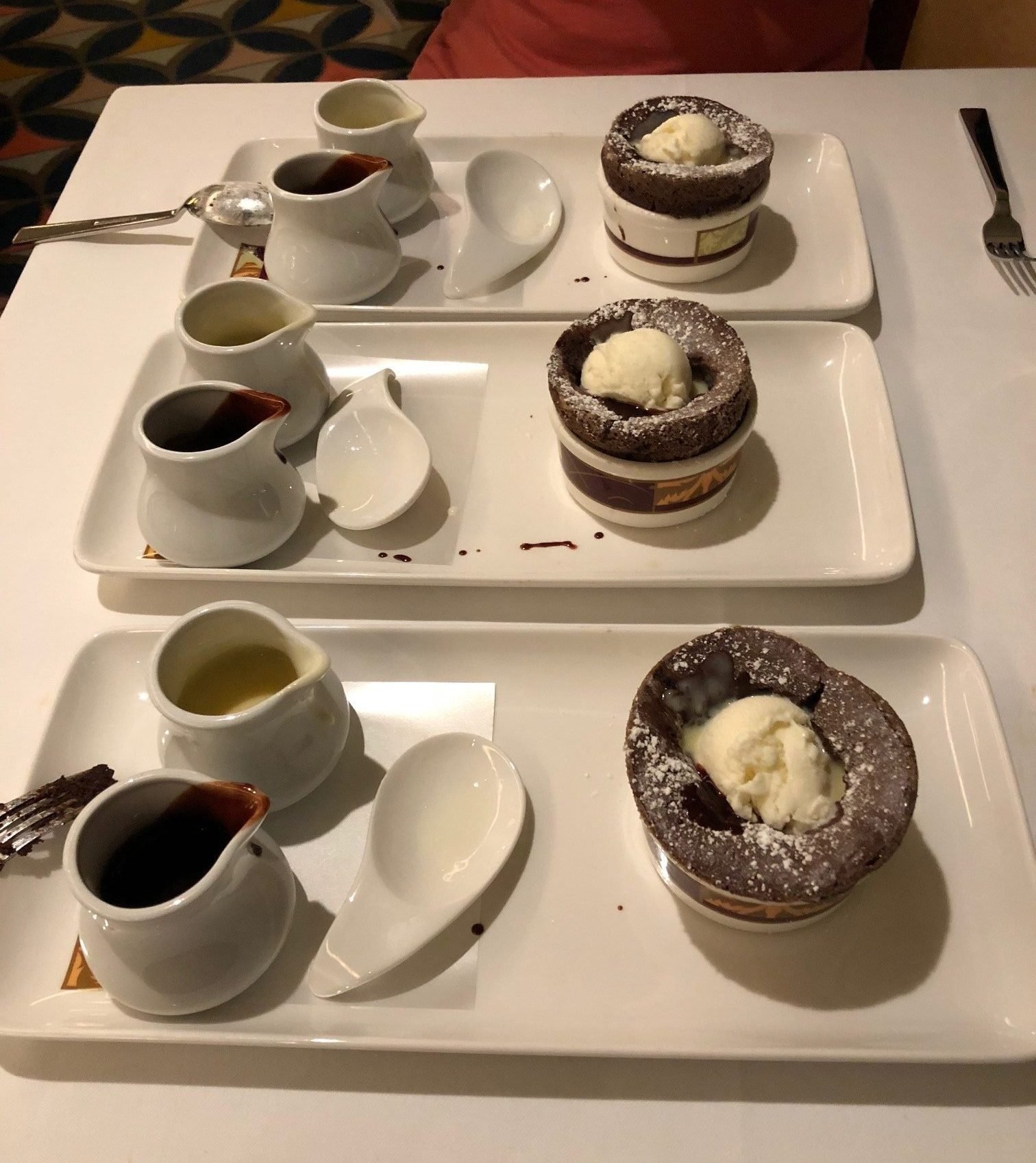 Chocolate souffle with sauces on a white plate